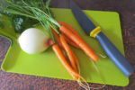 vegetables on a green chopping board