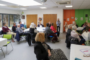 Photo of new members and convenors attending the New Members Cream Tea meeting in the Hub at Castleview on 11/03/2025